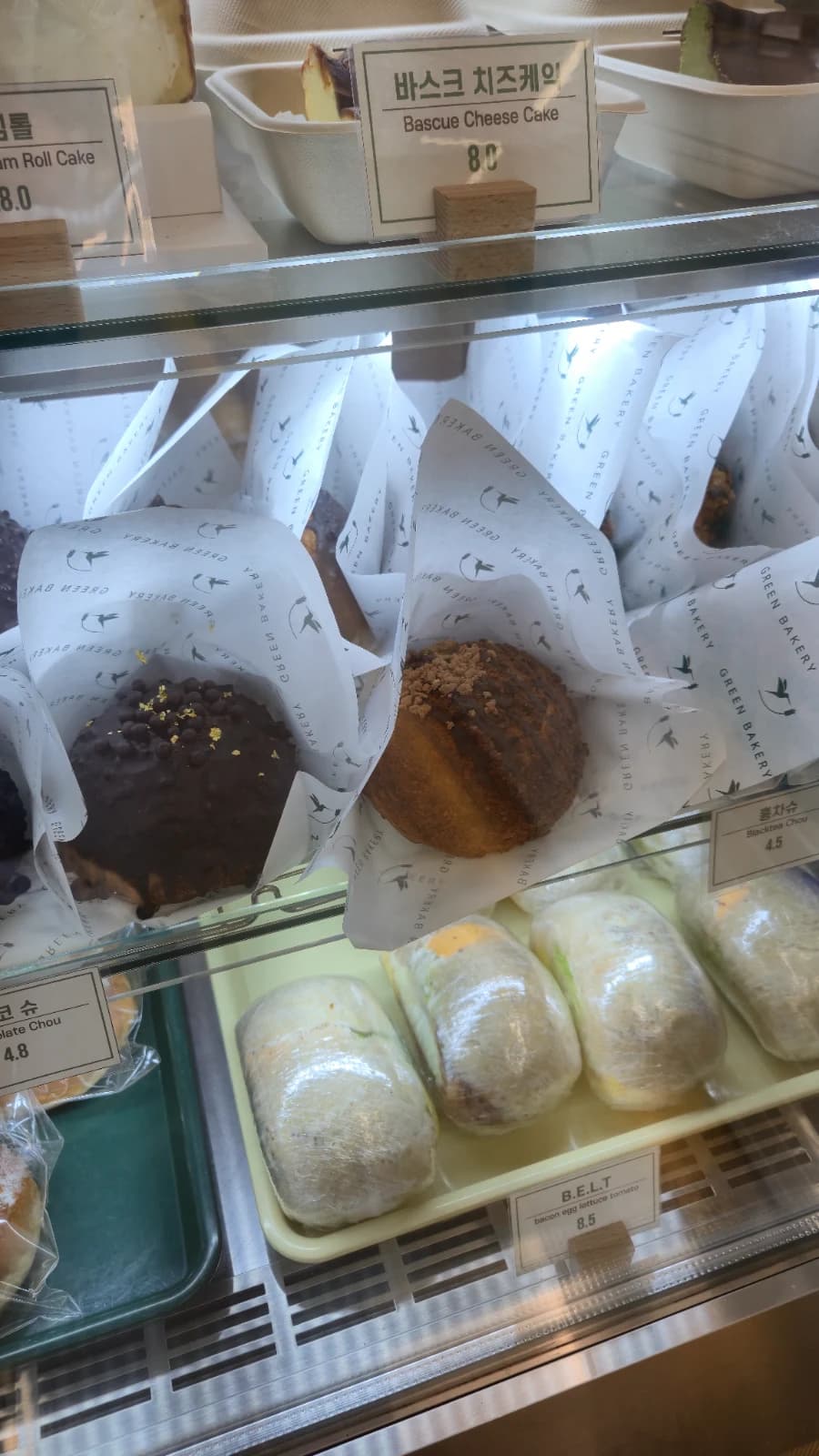 Green Bakery black tea choux next to basque cheesecake