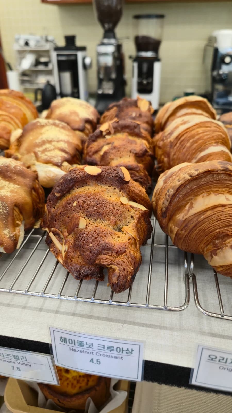 Green Bakery hazelnut croissant with almond slices and cookie-like crust
