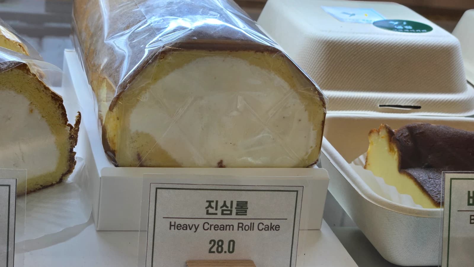 Green Bakery Jinsim Roll fresh cream roll cake whole for about twenty dollars or one slice for five dollars