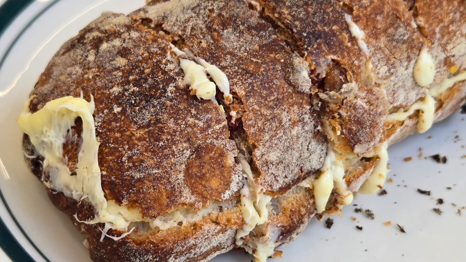 Cranberry cream cheese baguette cross-section showing cream cheese and cranberries inside