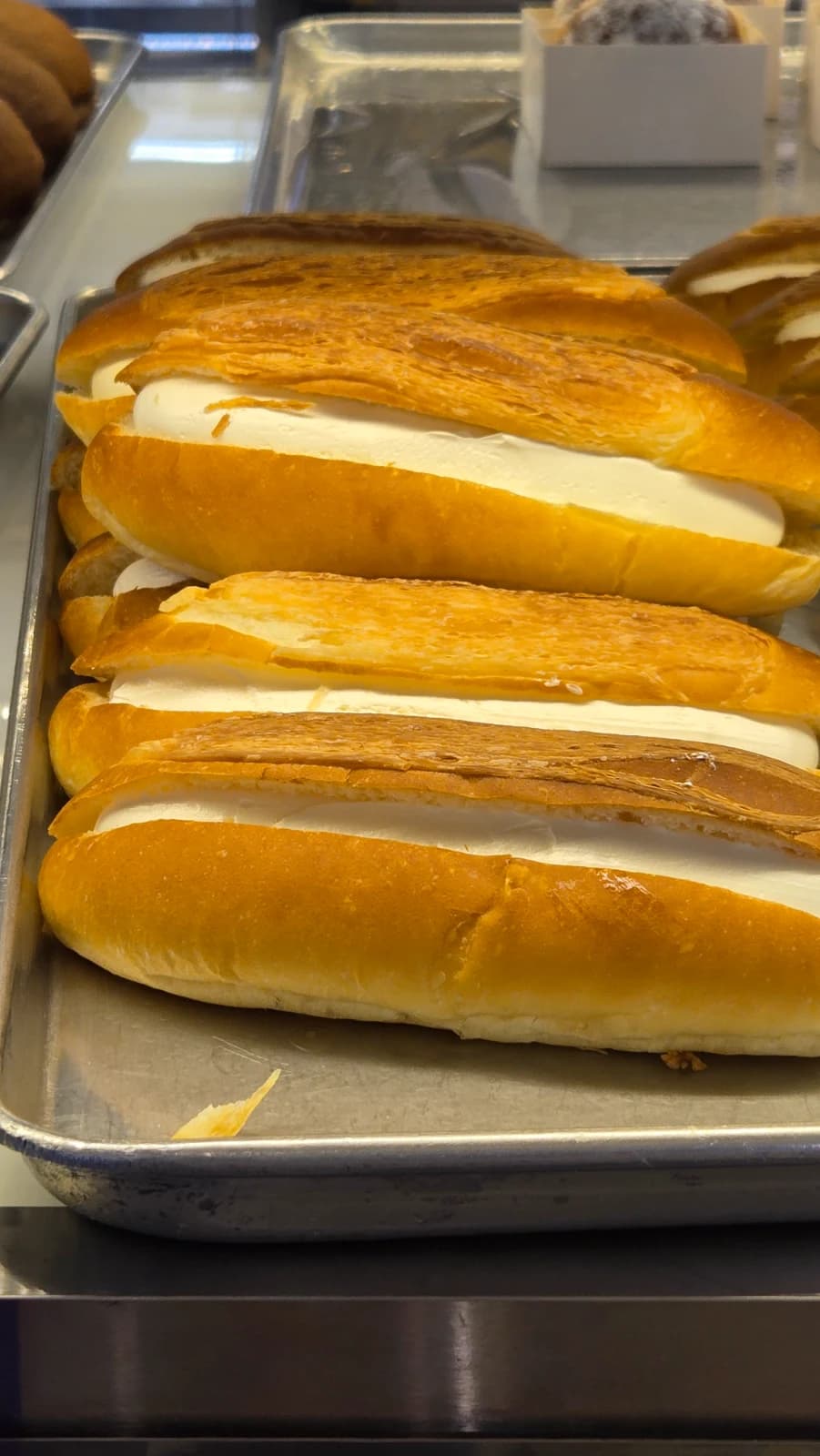 Long cream filled bread sliced layers bakery