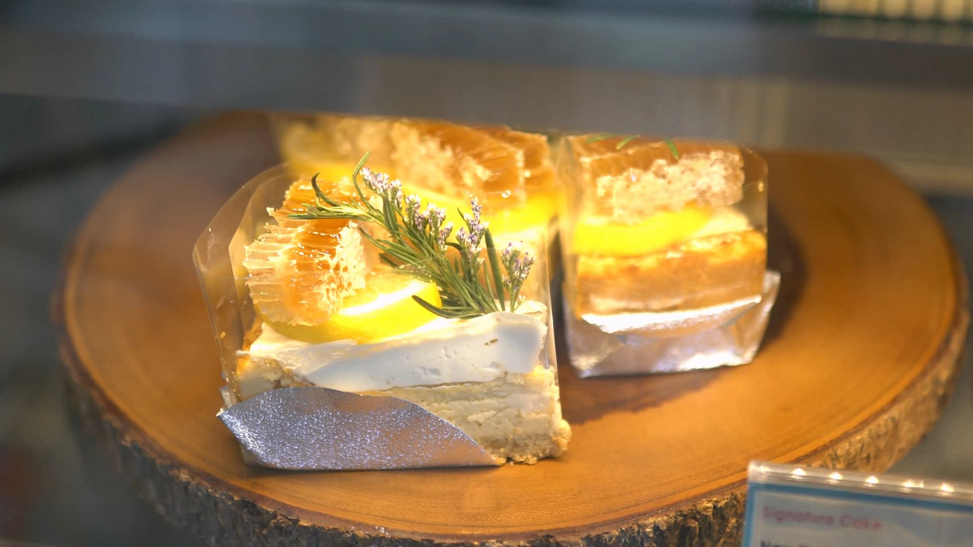 The Creeper House signature honeycomb cake with cream cheese topped with real honeycomb and a rosemary sprig