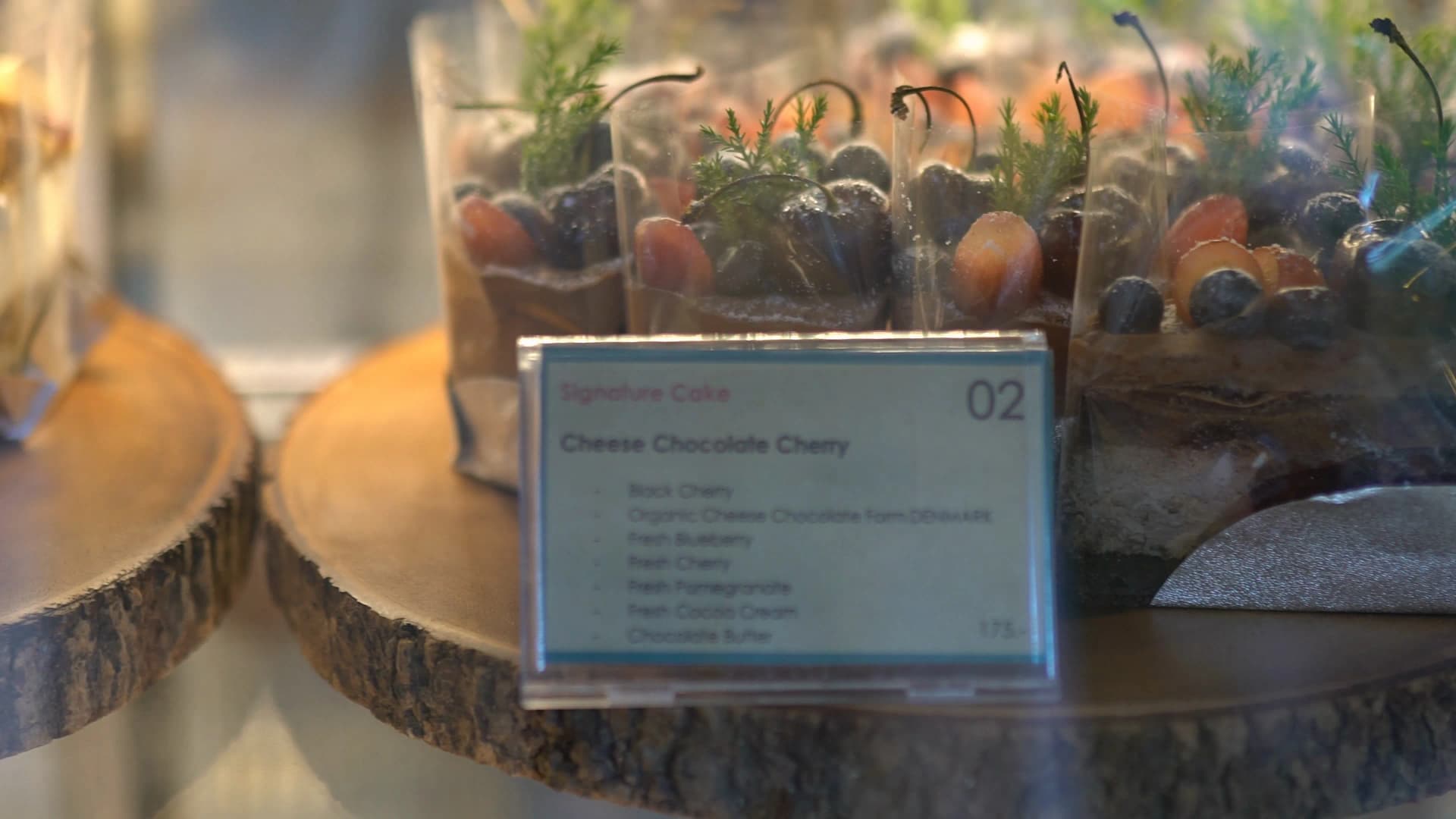 Signature cheese chocolate cherry cake with black cherries and organic Danish cheese chocolate, priced at 175 baht