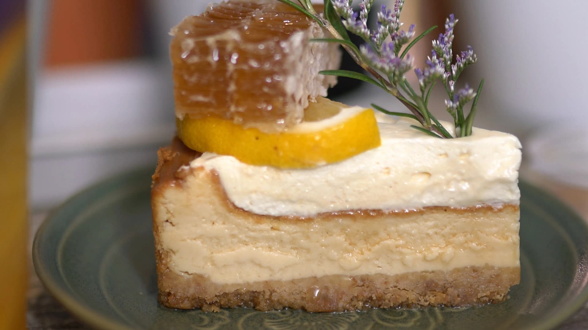 Full view of The Creeper House garden with tropical flowers, trees, and outdoor seating scattered throughout