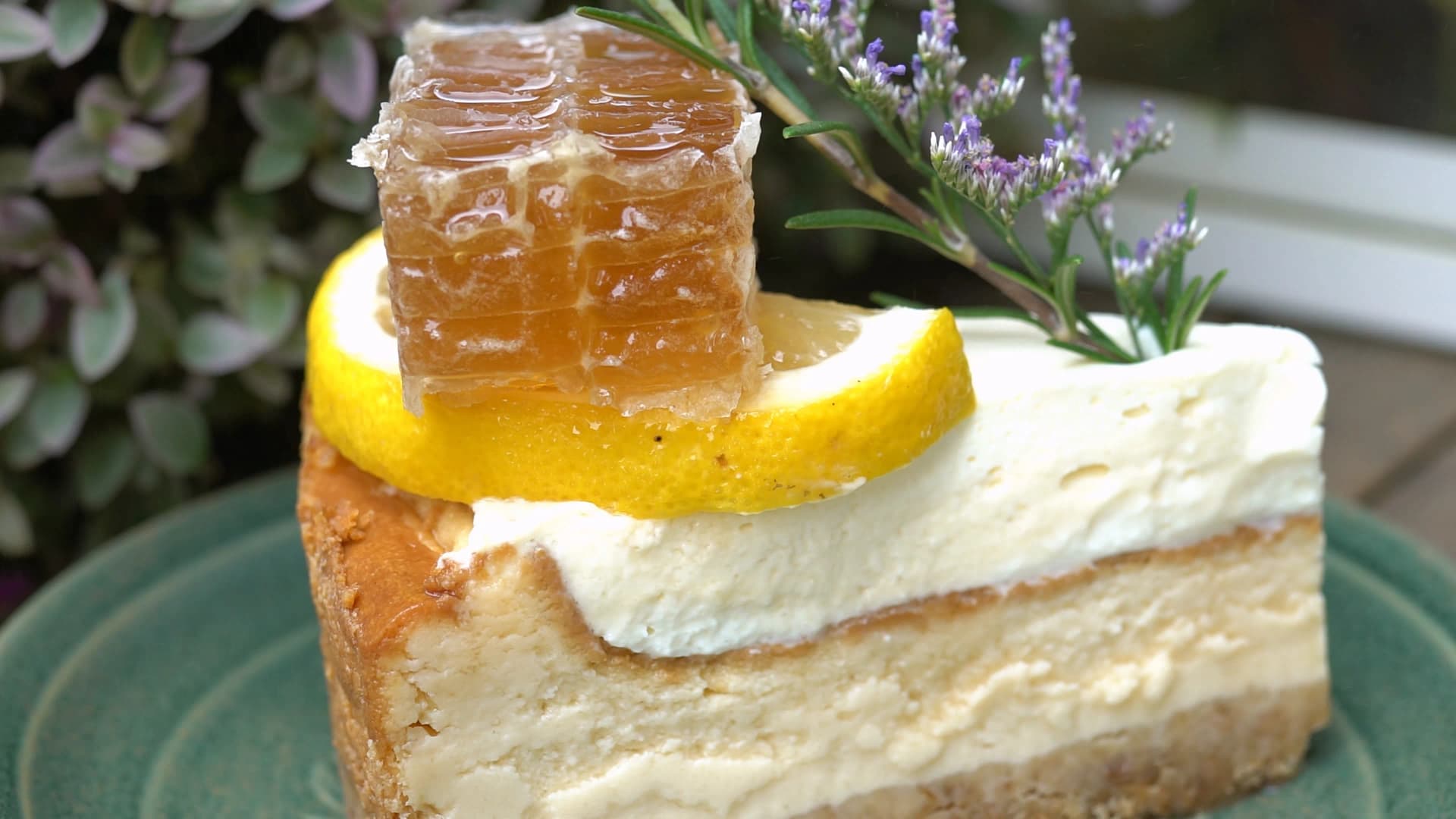 Fork cutting through the honeycomb cake revealing the soft cheese layer and moist base beneath
