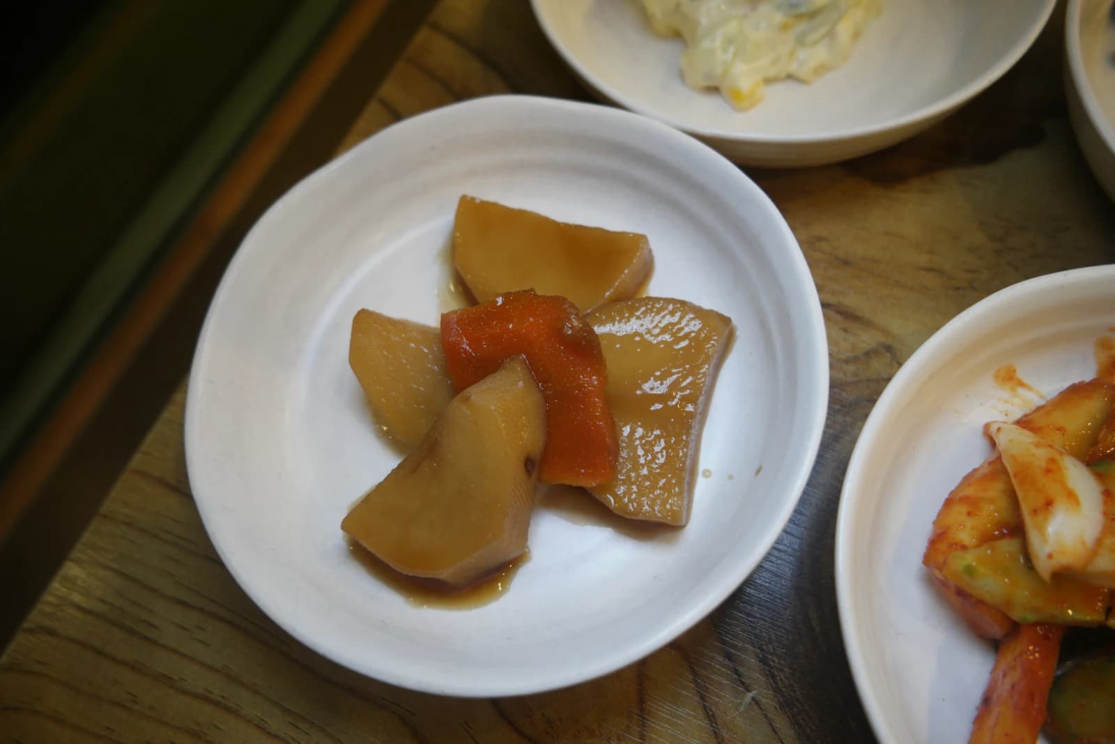 Danmuji, thick-sliced Korean pickled radish in sweet soy brine