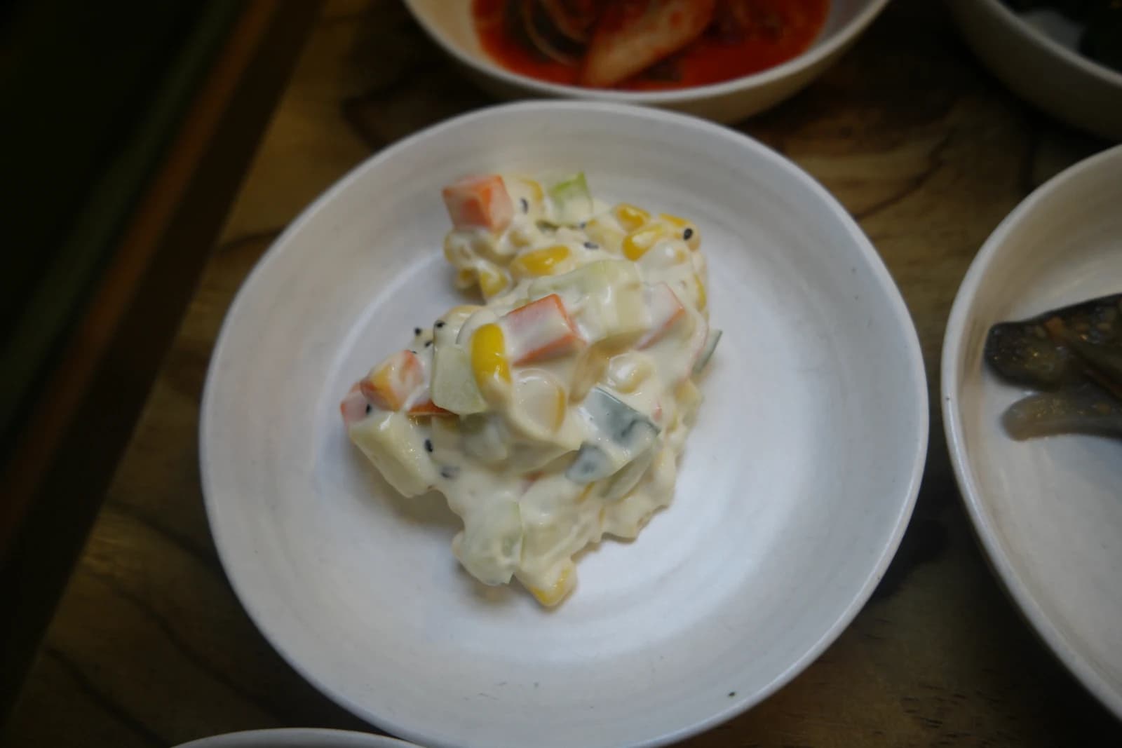 Korean-style potato salad with corn kernels and imitation crab in mayonnaise