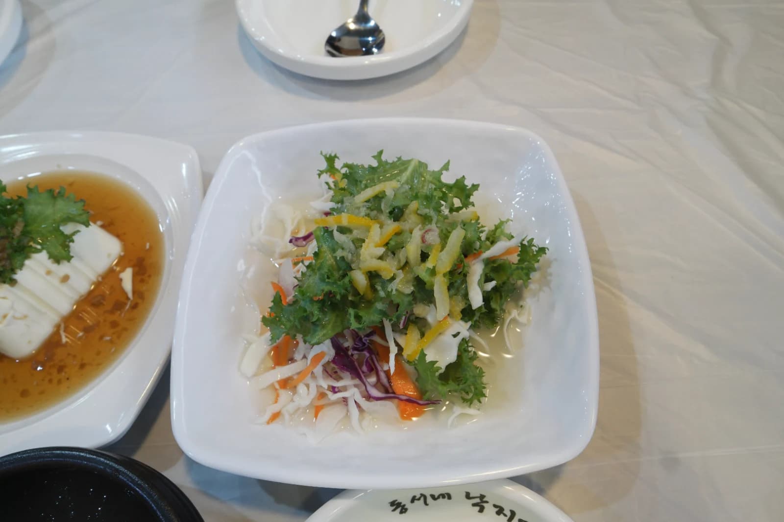 Korean-style salad banchan with red cabbage carrots bell pepper and lettuce leaves