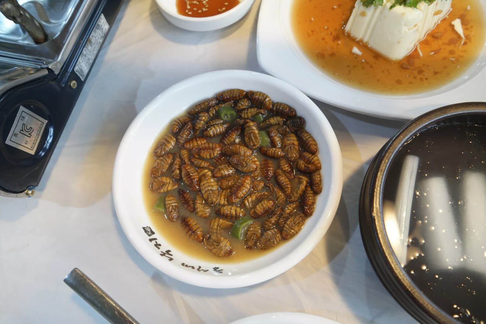 Boiled and seasoned silkworm pupae beondegi a traditional Korean snack served as a side dish