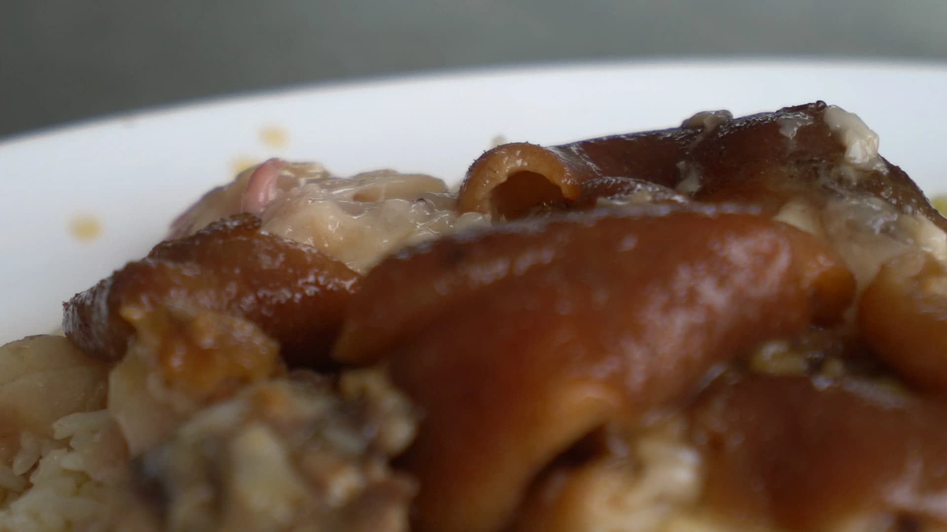Overhead shot of khao kha moo plate showing braised pork and pickled mustard greens