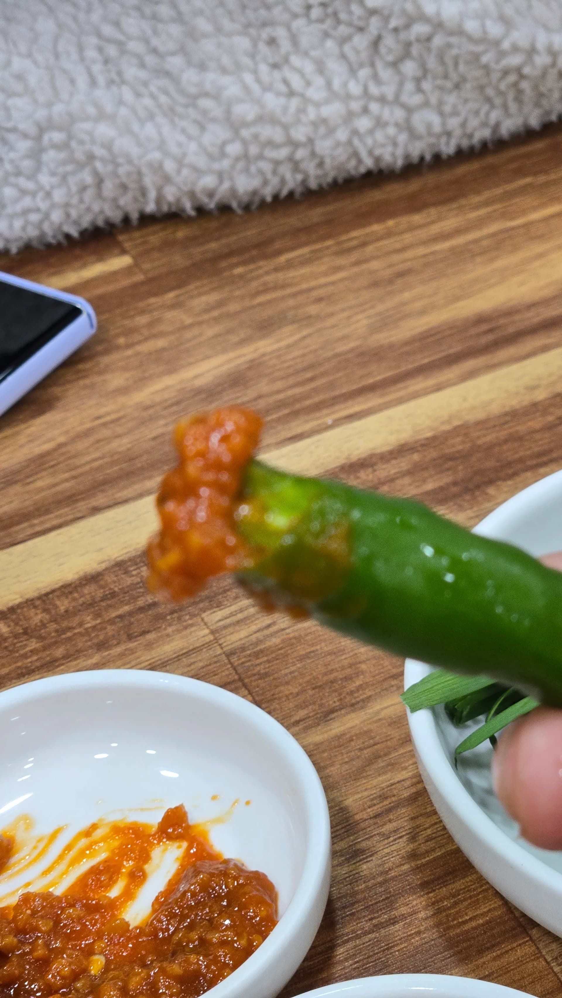 Cheongyang green chilli peppers served with ssamjang dipping paste as a spicy Korean side dish