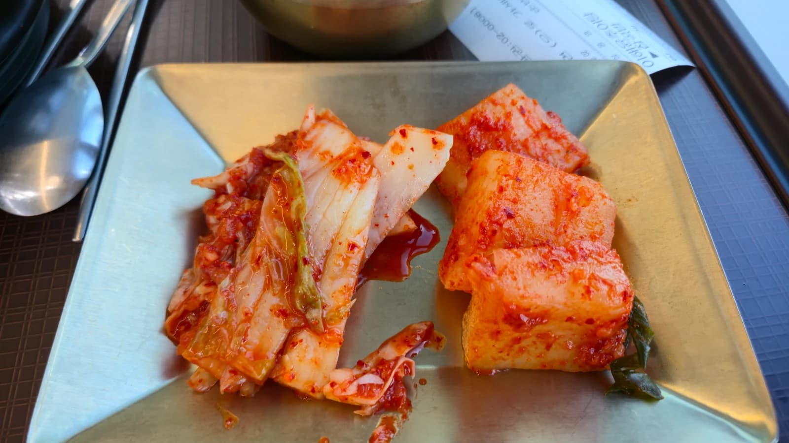 Napa cabbage kimchi and cubed radish kimchi side dishes