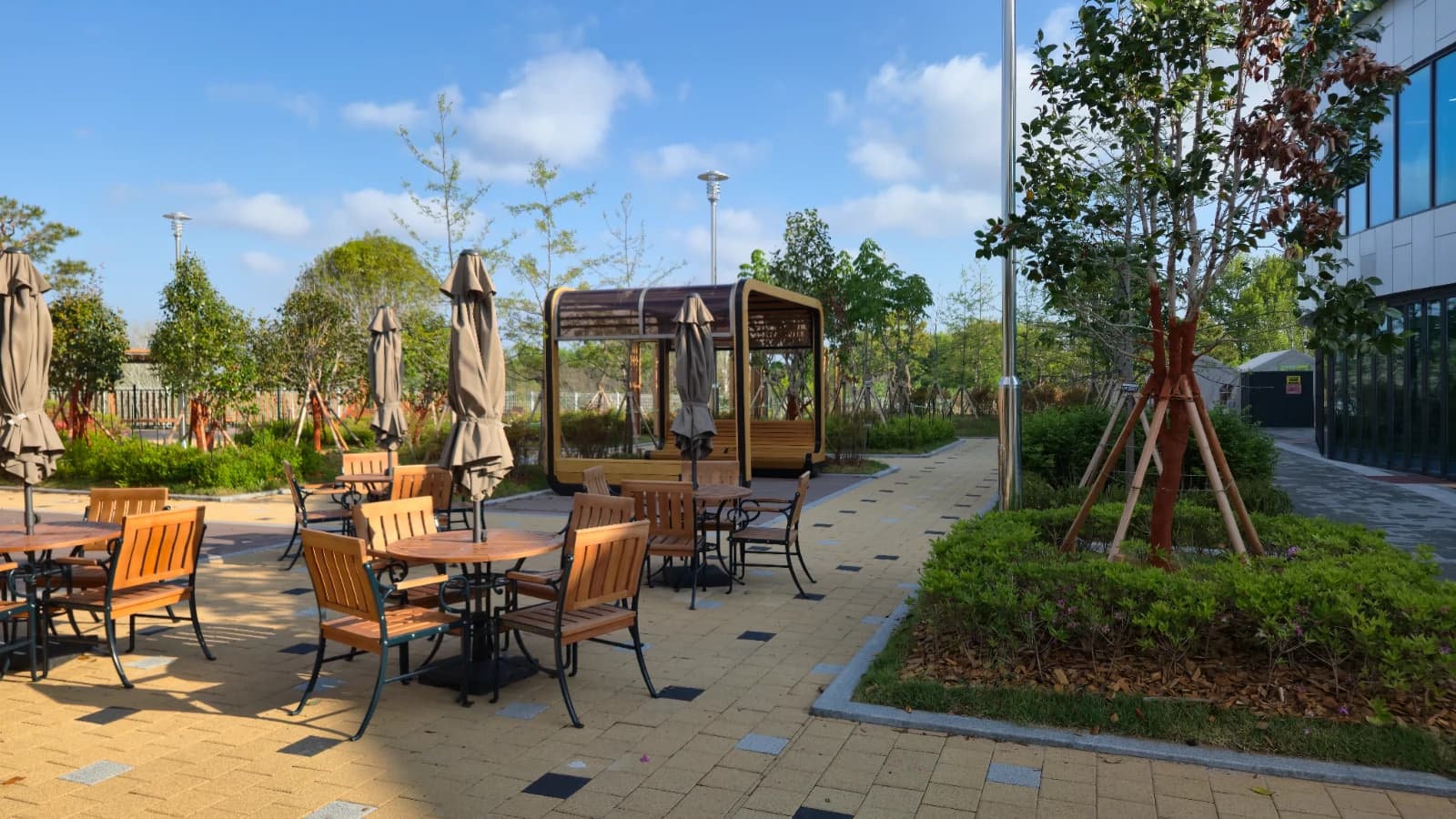 Gimje rest stop outdoor park with wooden tables and parasols on the terrace