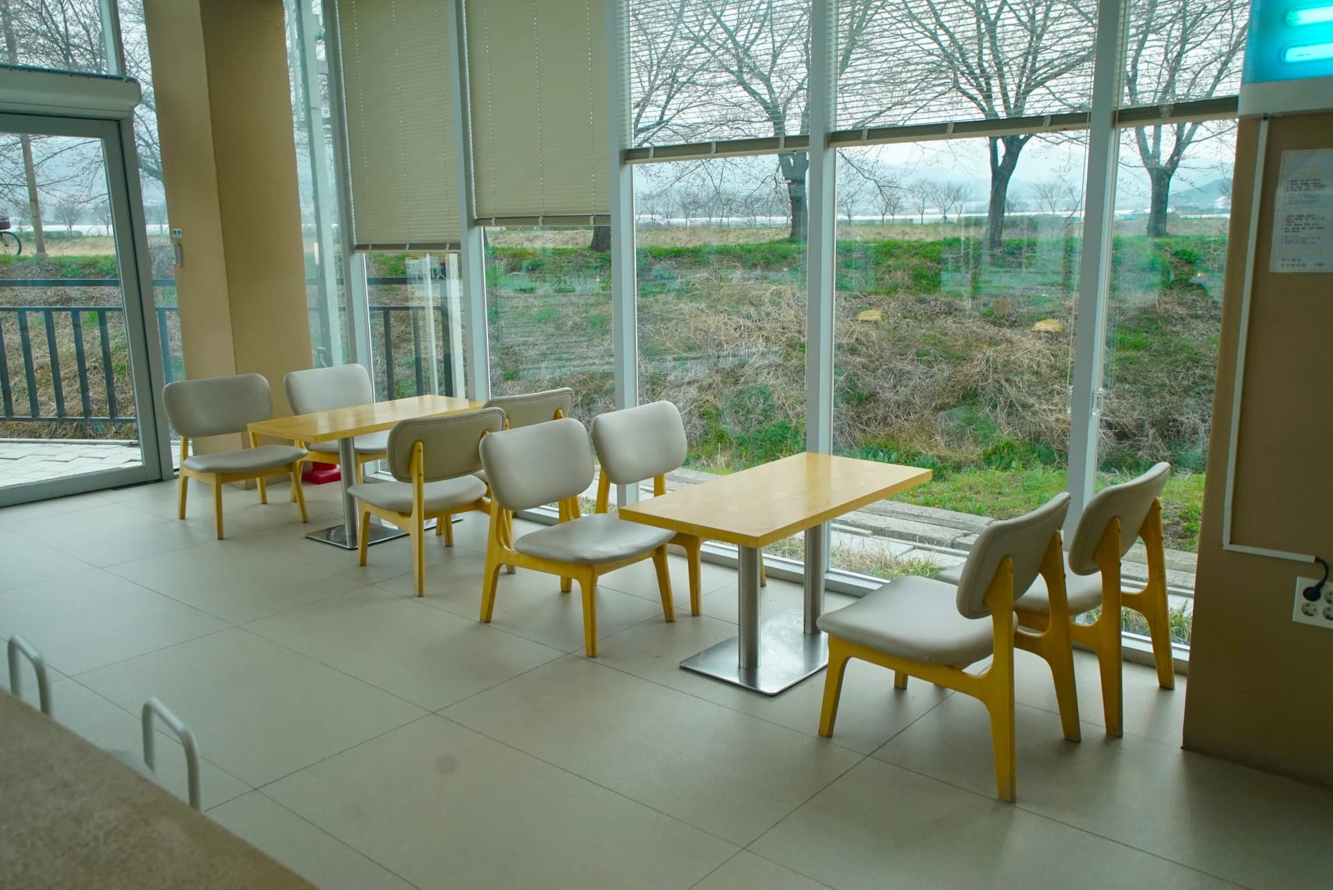 Various ground floor seating options including two-top tables, bar stools and cushioned sofas at the garden cafe