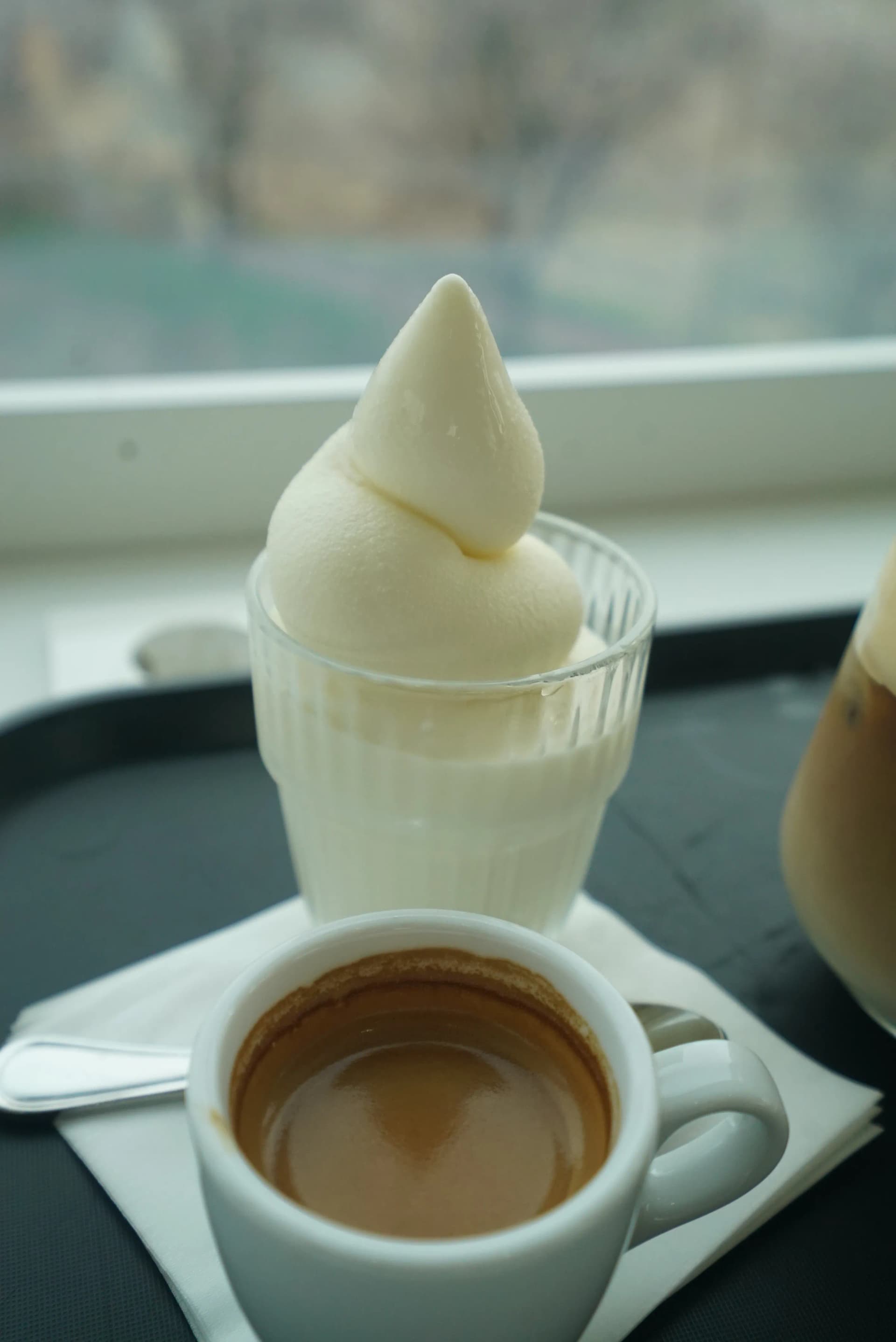 Affogato espresso shot alongside the soft serve ice cream ready to pour