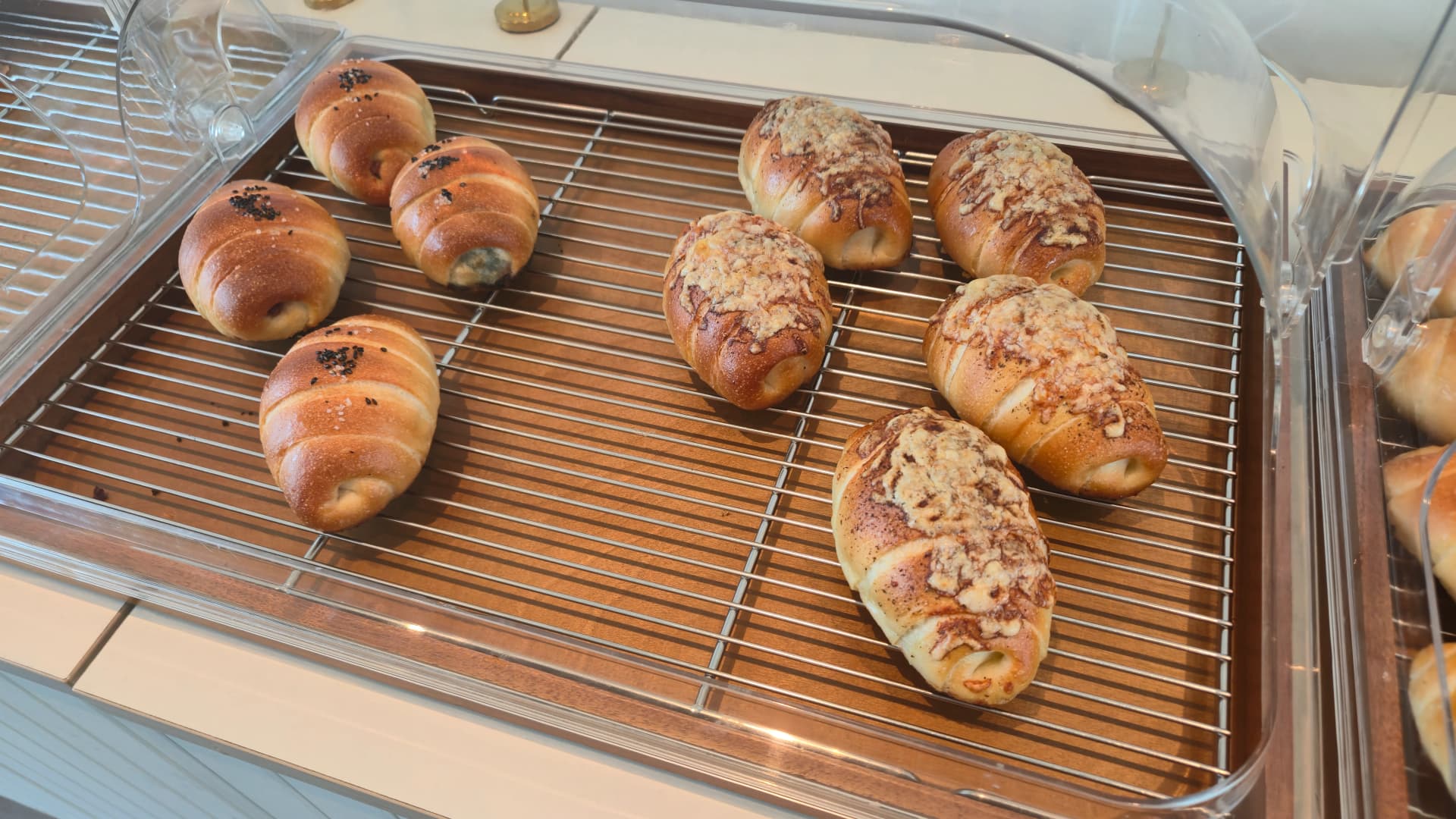 Perilla truffle salt bread and crumble salt bread placed side by side on a tray