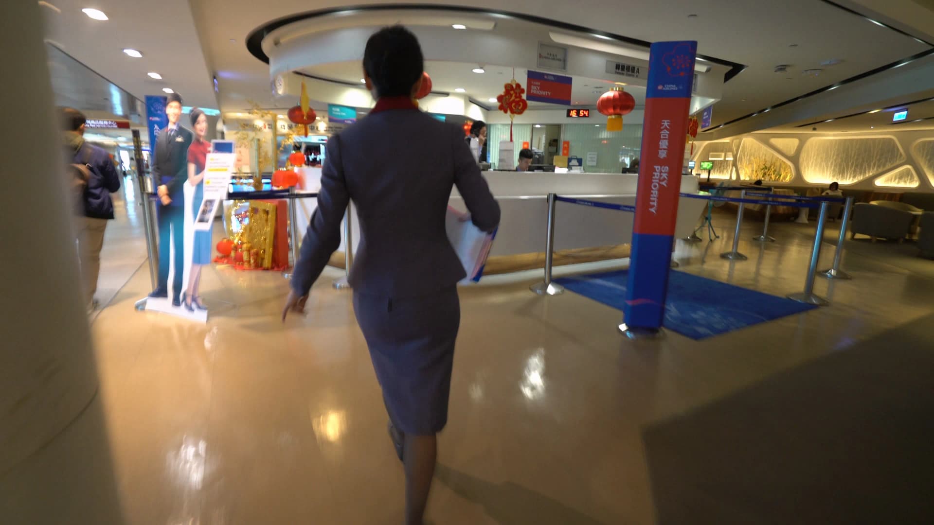 Suvarnabhumi Airport China Airlines check-in counter with delay notification on screen