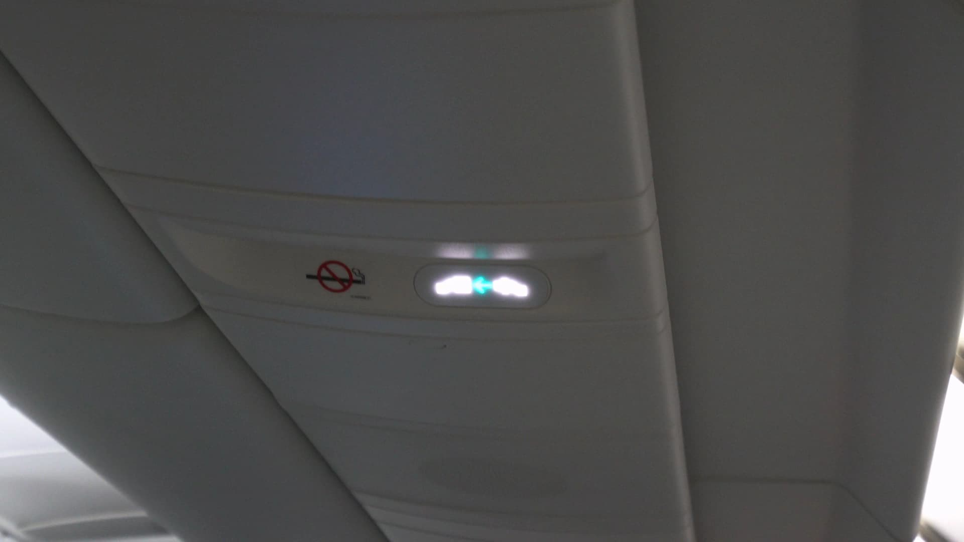 No smoking sign and seatbelt indicator lights inside Korean Air 747-8i cabin