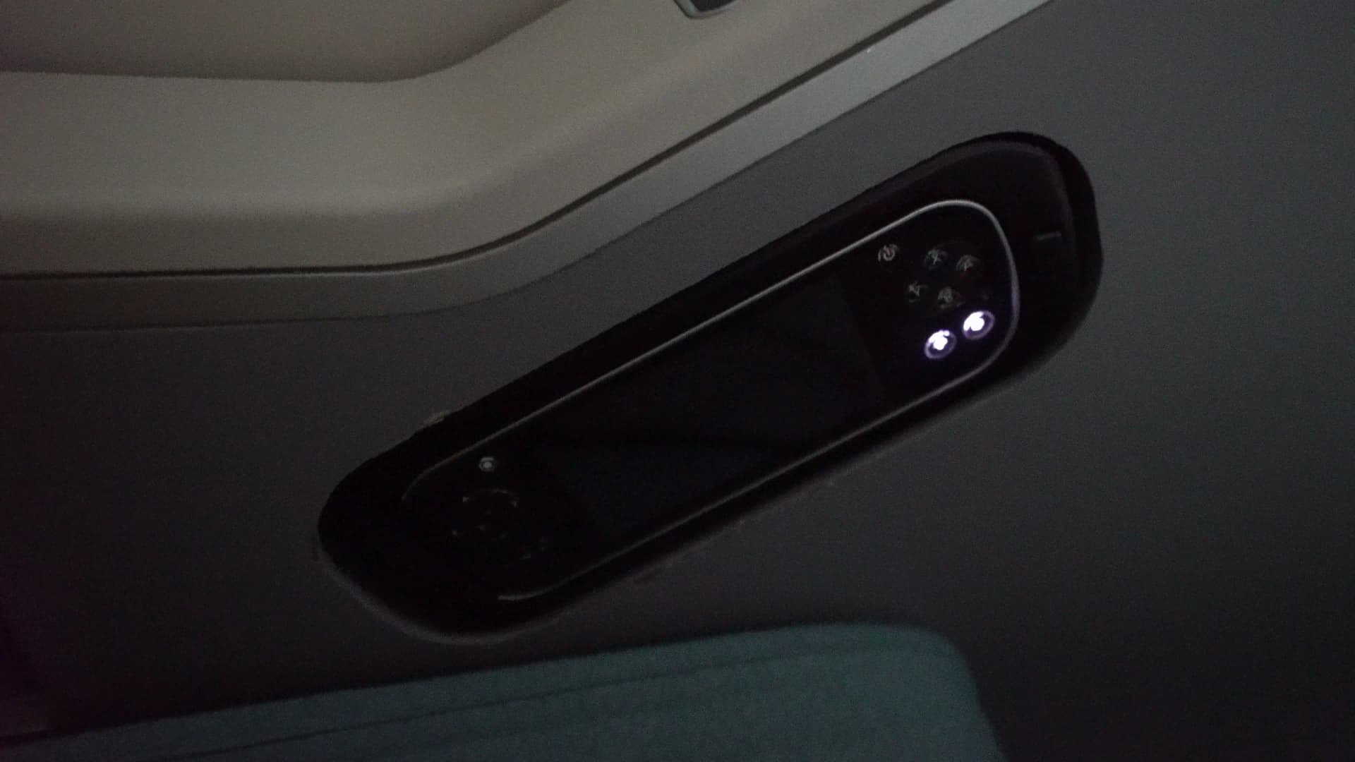 Wired remote control unit attached to Korean Air 747-8i Prestige Class seat armrest
