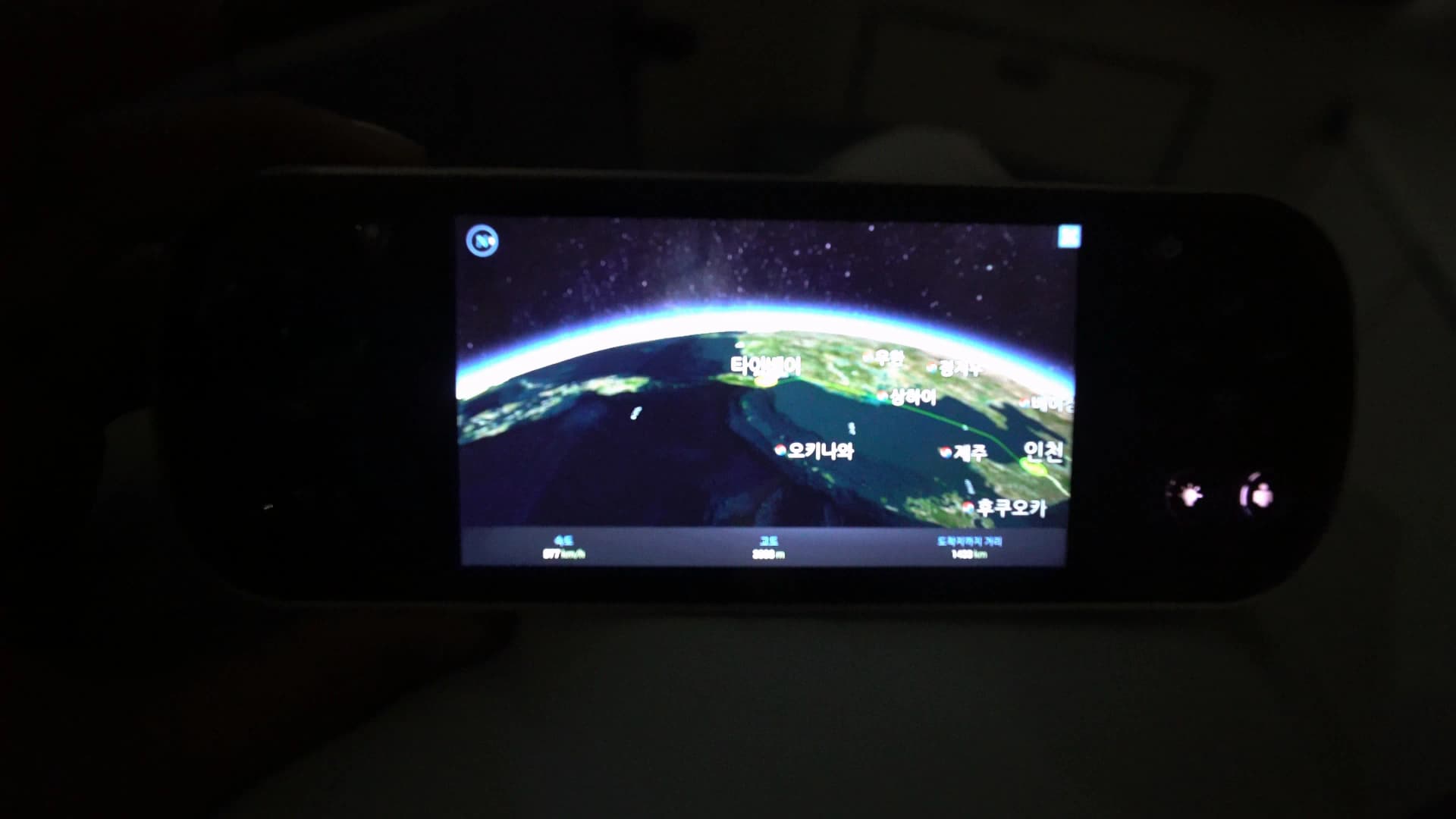 Air Show screen on Korean Air 747-8i remote showing flight path passing Okinawa heading toward Jeju