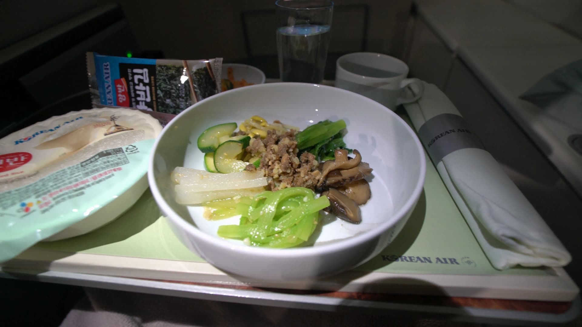 Korean Air 747-8i Prestige Class short-haul in-flight meal tray setup with bibimbap selection