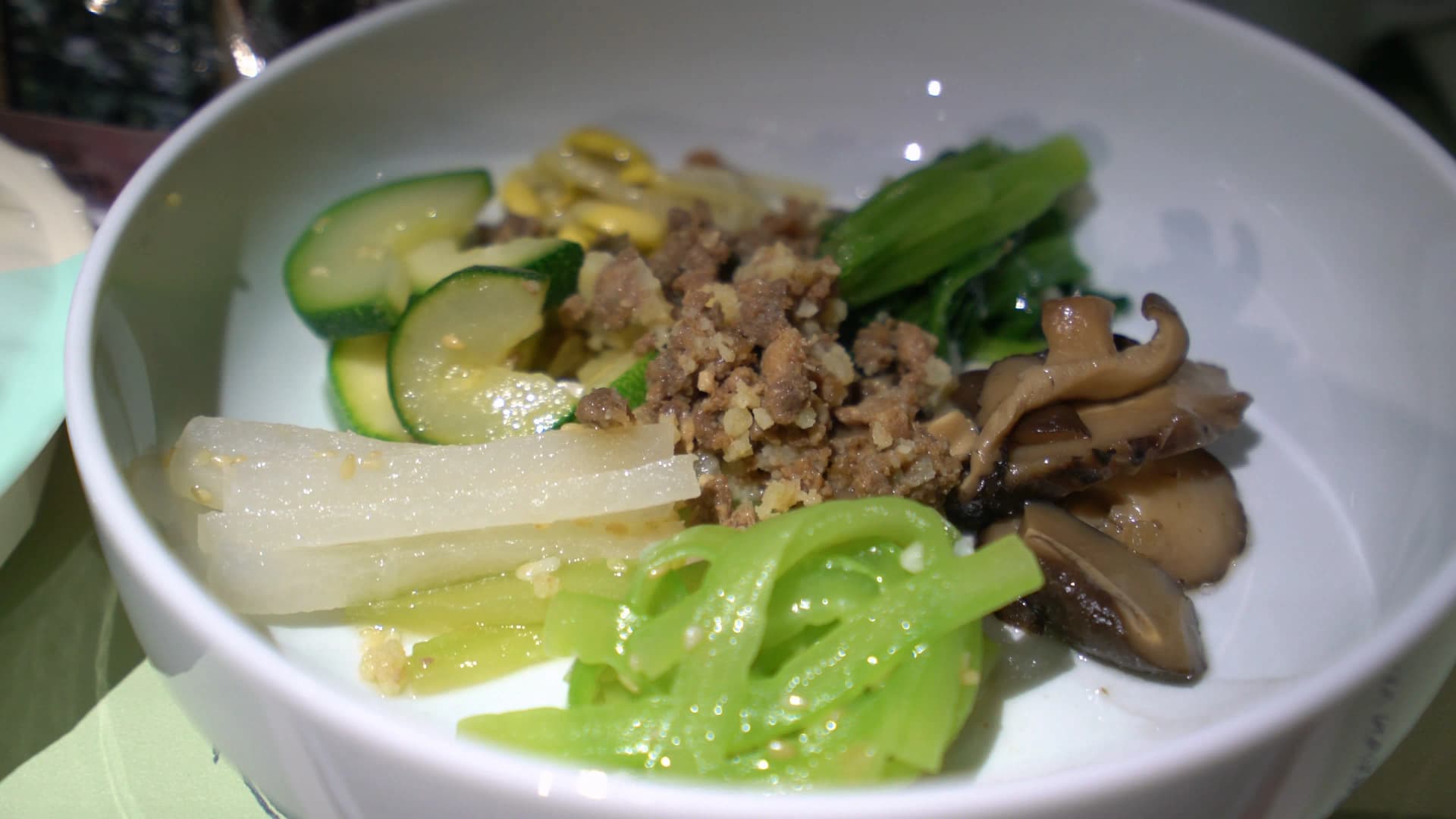 Korean Air Prestige Class bibimbap vegetable set with zucchini bean sprouts spinach mushroom balloon flower root bracken and beef in individual containers