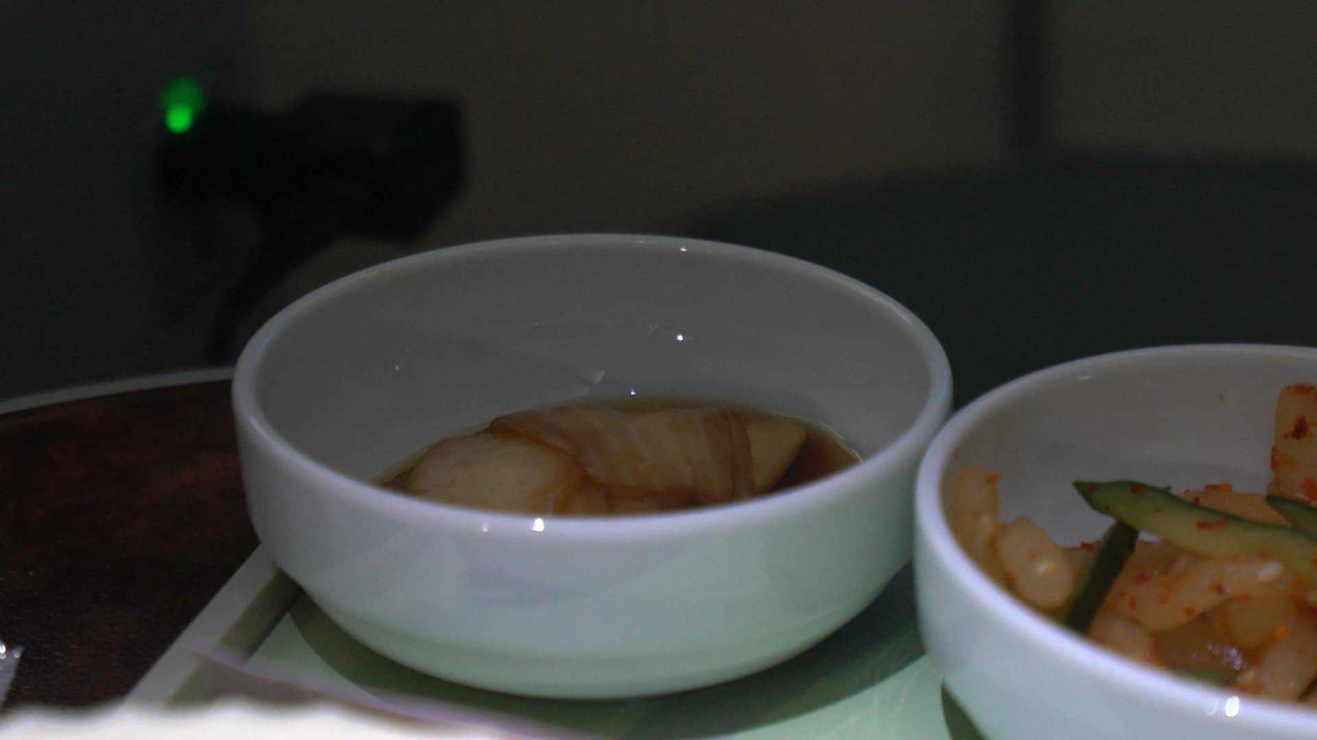 Pickled onion side dish accompanying Korean Air in-flight bibimbap